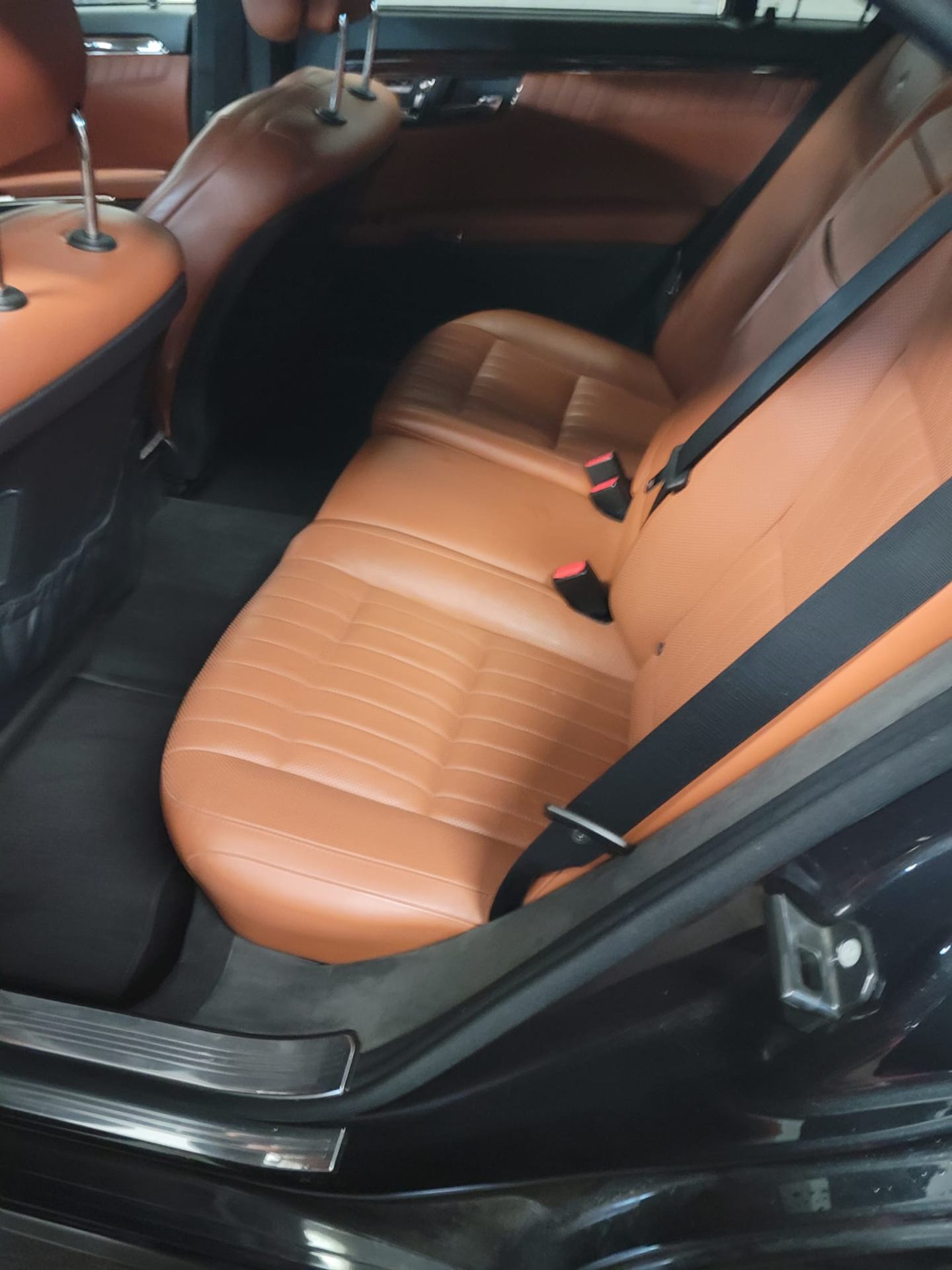Mercedes-Benz interior — deep-cleaned tan leather rear seats