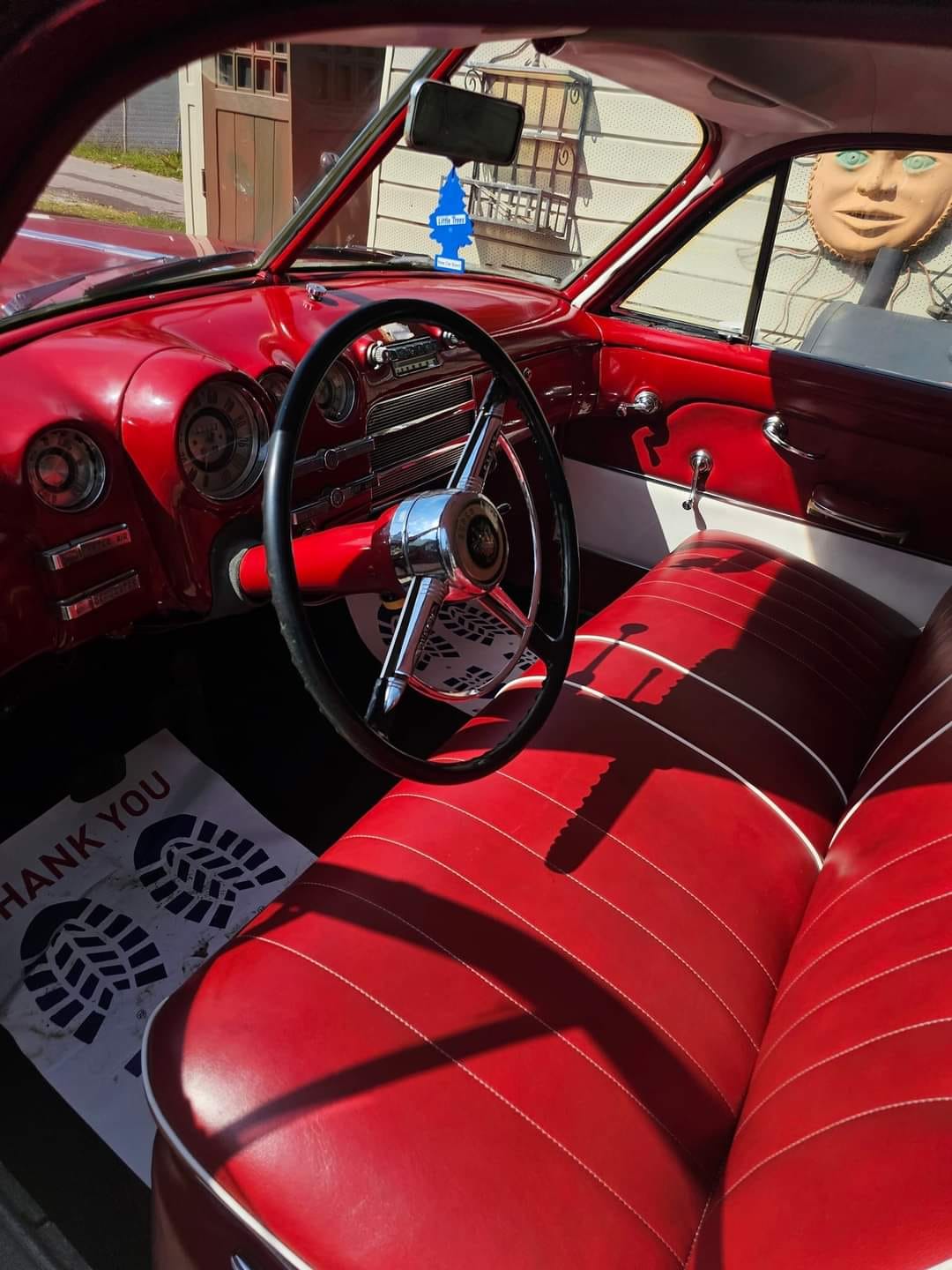 Classic Buick interior — steering wheel and dashboard detailed